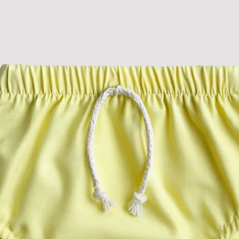 tapa fralda amarelo em linho para bebê
