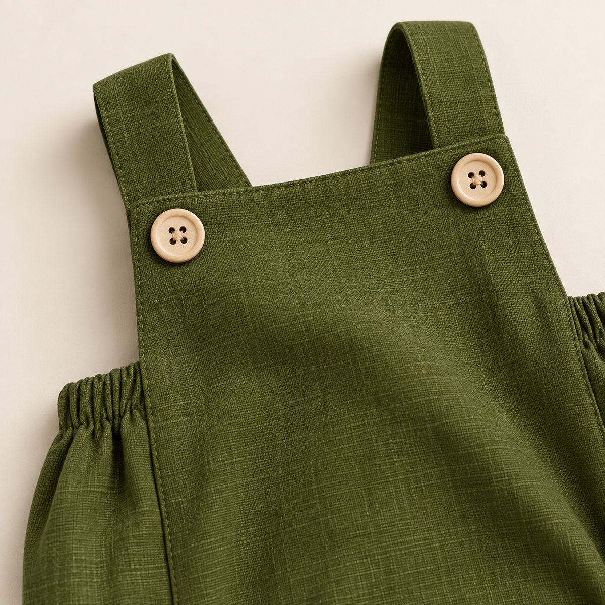 Mono tradicional de lino verde musgo para bebé
