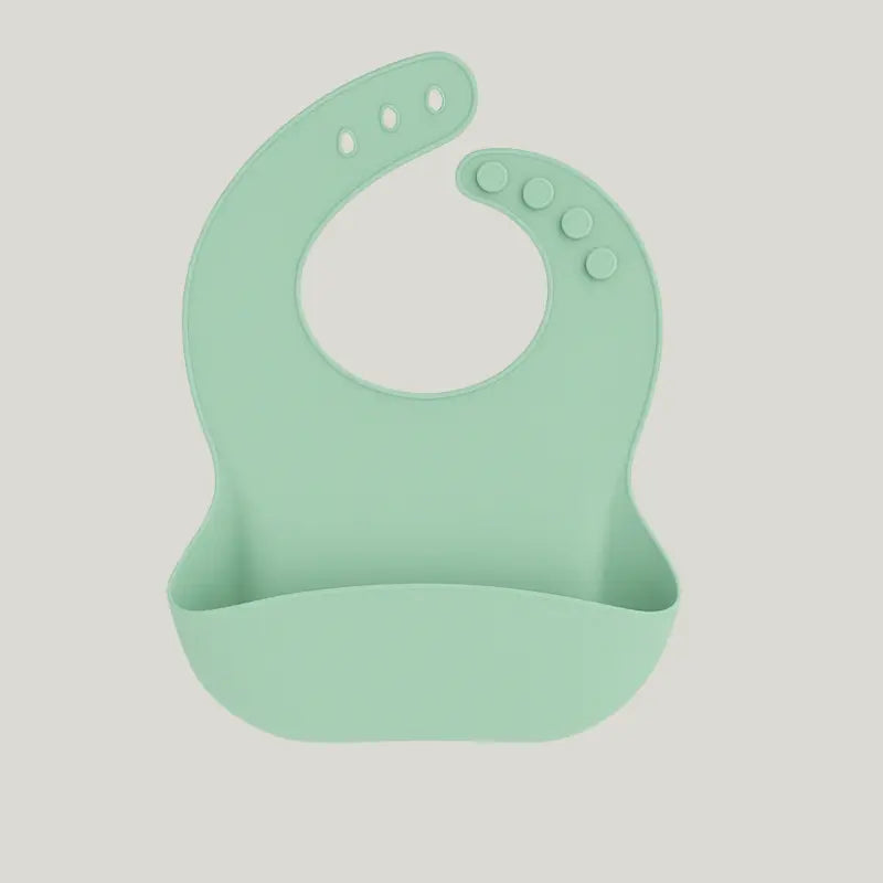 babador de silicone verde menta com bolso pega migalhas

